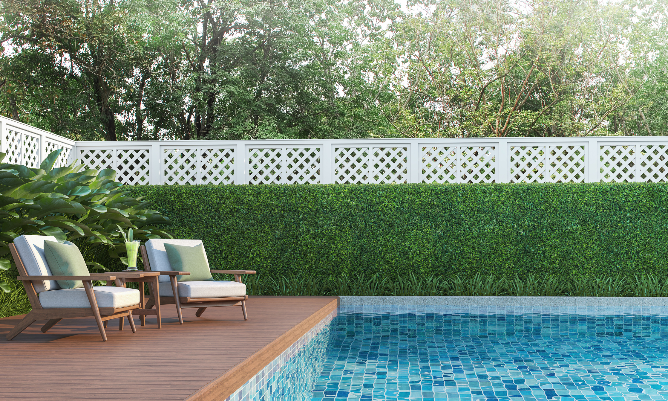 Backyard swimming pool with a wood deck and lounge chairs